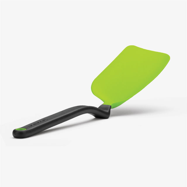 Green spatula with black handle on a white background