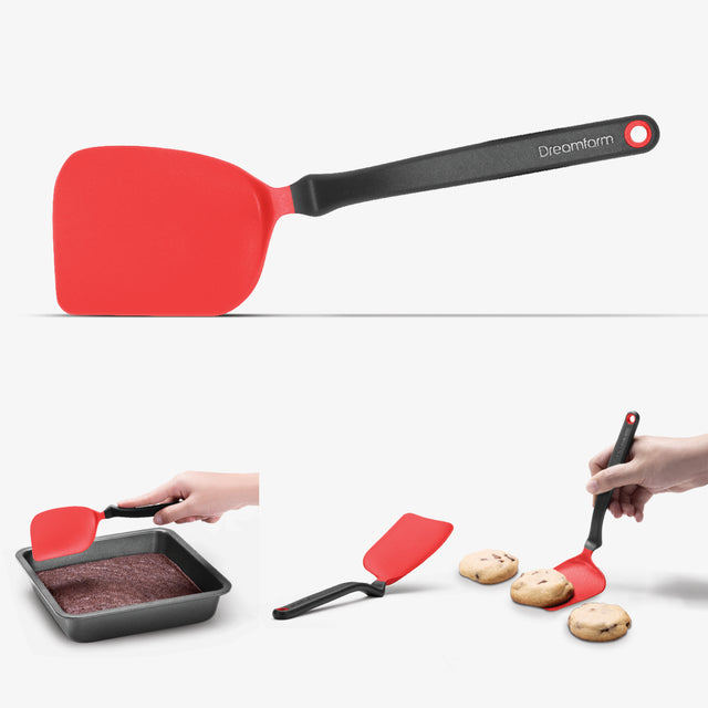 Red spatula with black handle used for baking and serving cookies on a white background