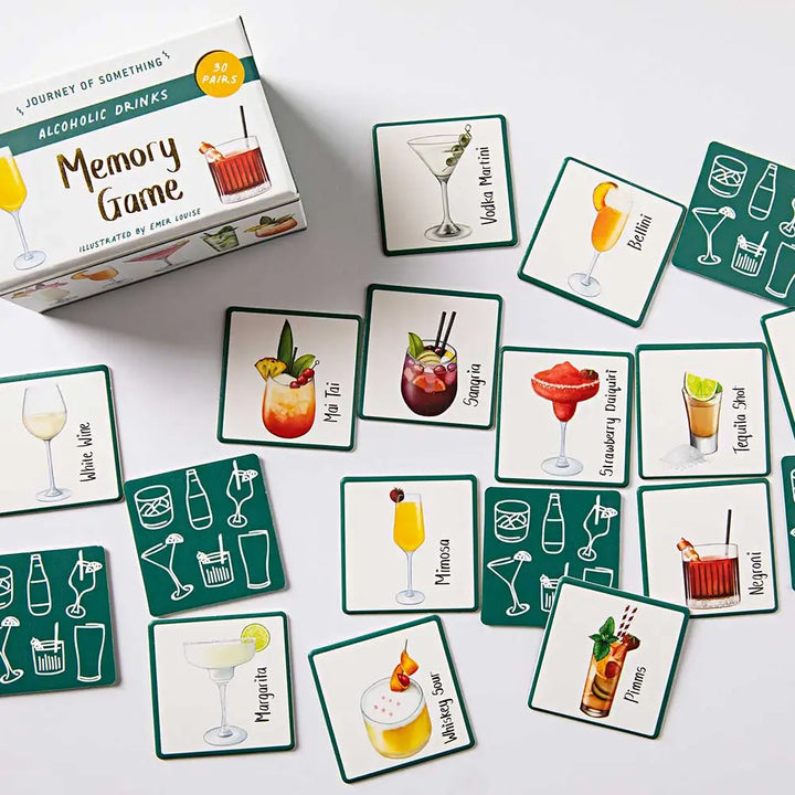 Alcoholic drinks memory game with cards and box on a white surface