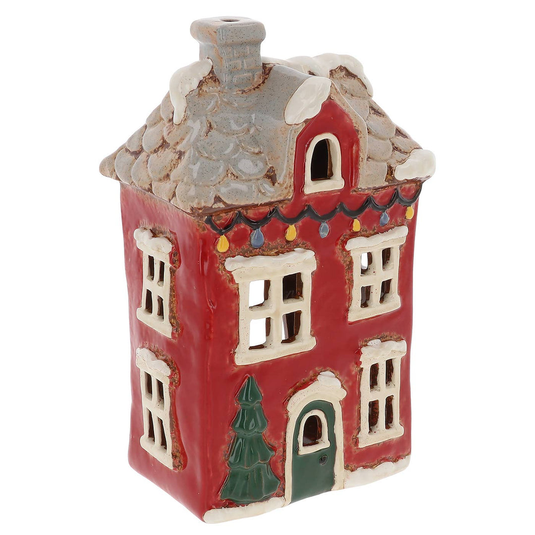 A small red ceramic house tealight holder with a gray shingled roof, white trim, a green door, and a green Christmas tree detail, shown on a plain white background.