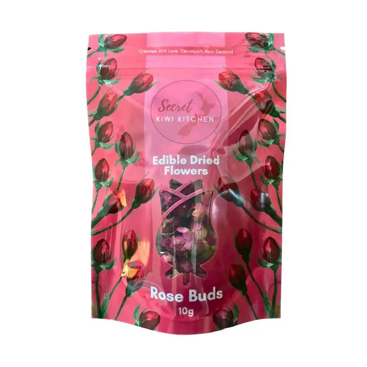 Pink packaging of Secret Kiwi Kitchen Edible Dried Flowers with rose buds design on a white background