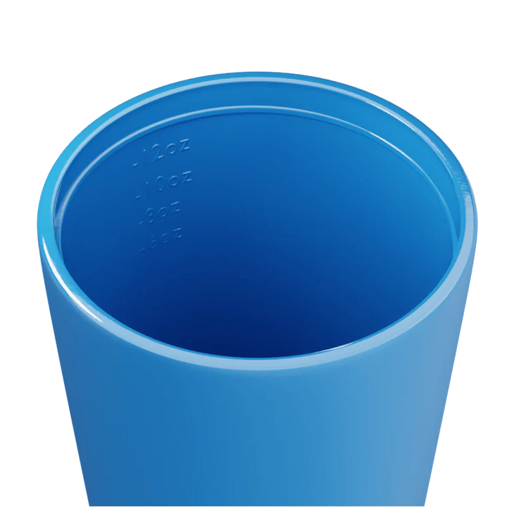Inside of a blue travel mug on a white background