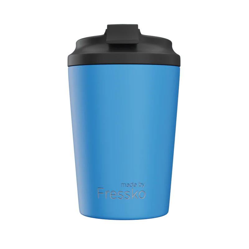 Blue tumbler with black lid on a white background