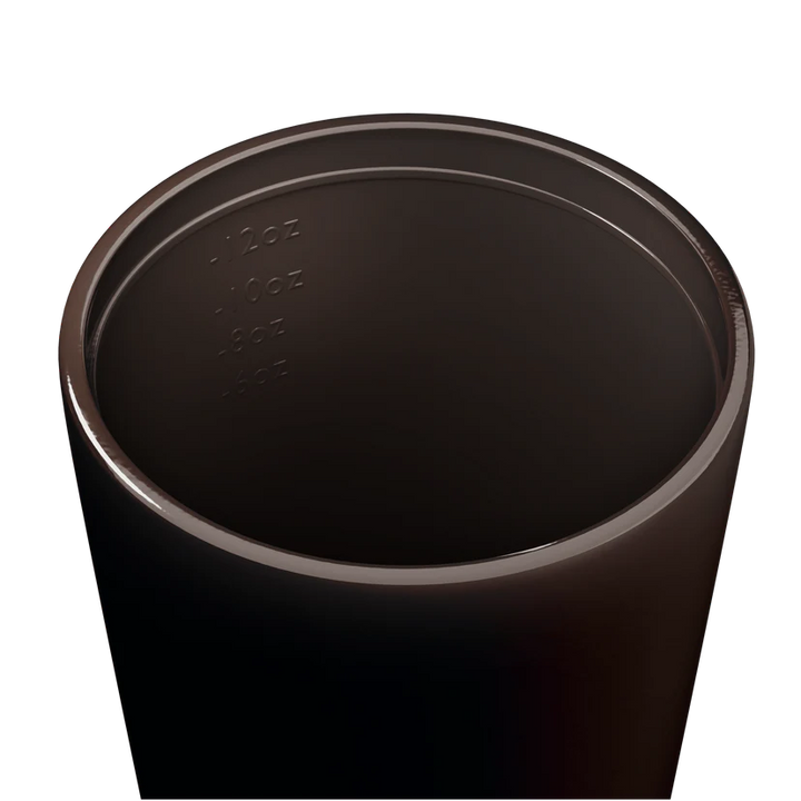 Inside of a brown travel cup on a white background