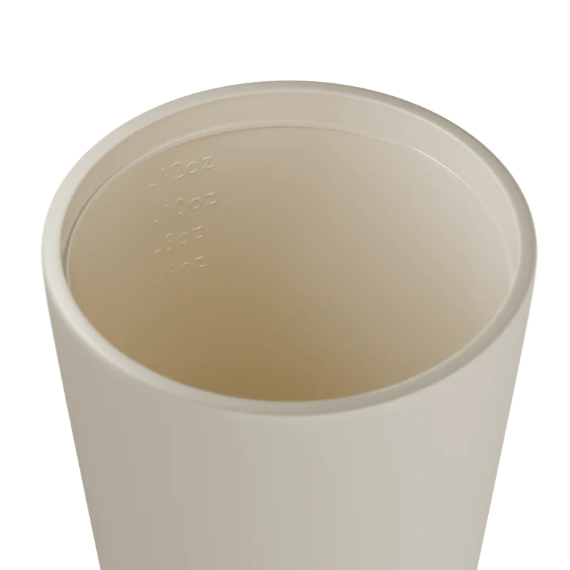 Inside of a white travel cup on a white background