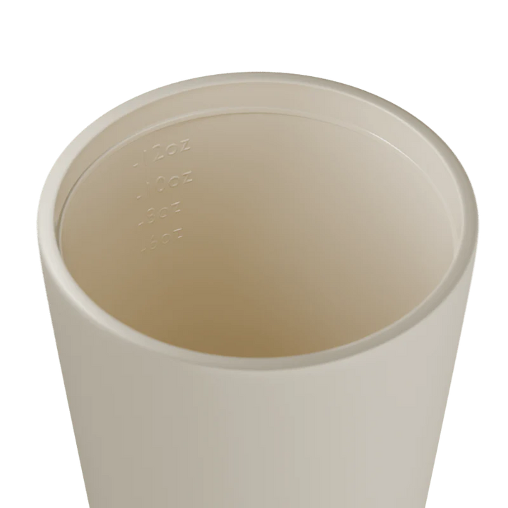 Inside of a white travel cup on a white background