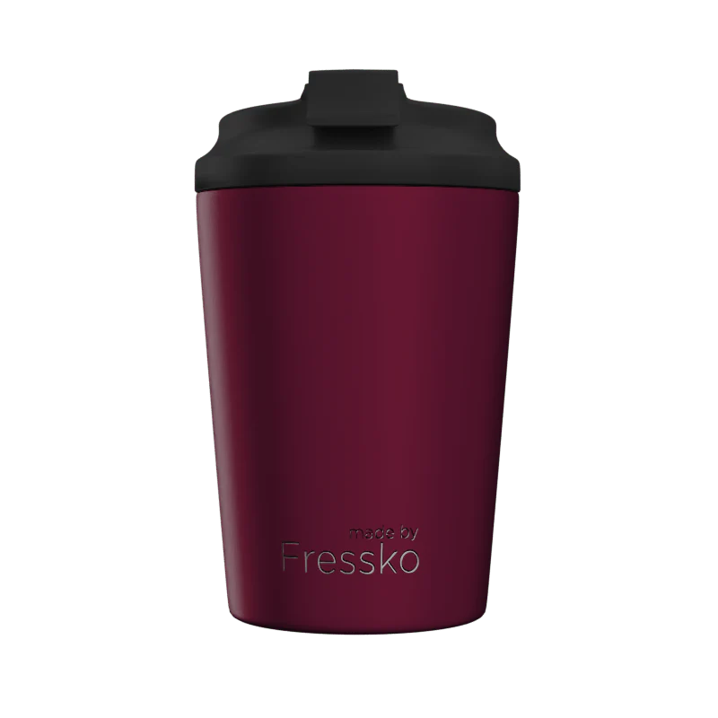 Maroon tumbler with black lid on a white background