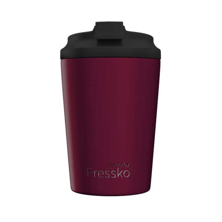Maroon tumbler with black lid on a white background