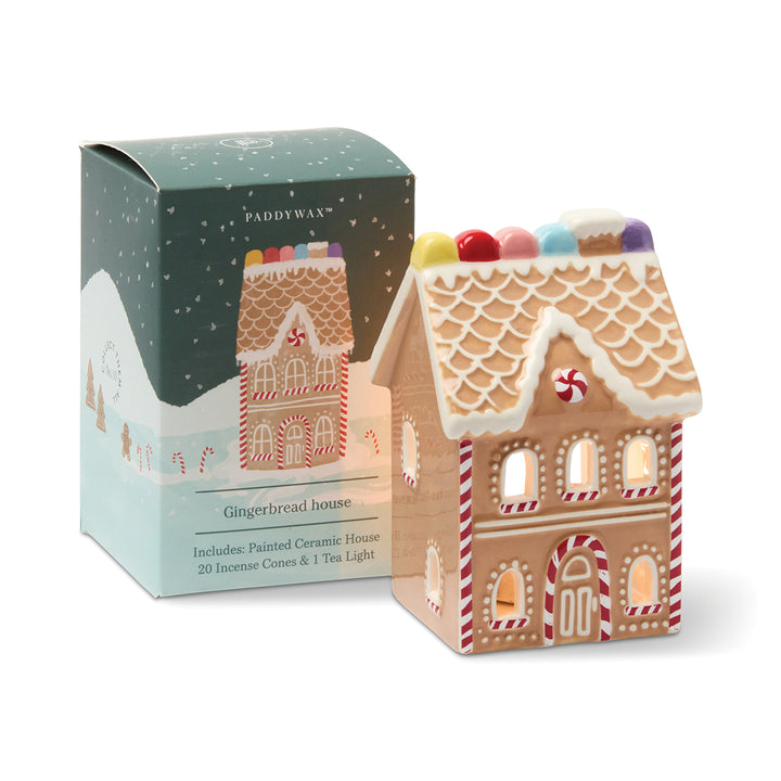Gingerbread house shaped incense and tea light holder with packaging on a white background