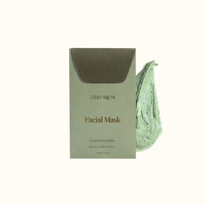 A green packet of Stray Willow facial mask with some of the product next to it on a white background