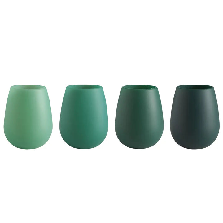 Four matte green stemless wine glasses arranged in a row on a plain white background, transitioning from light mint green to dark forest green.