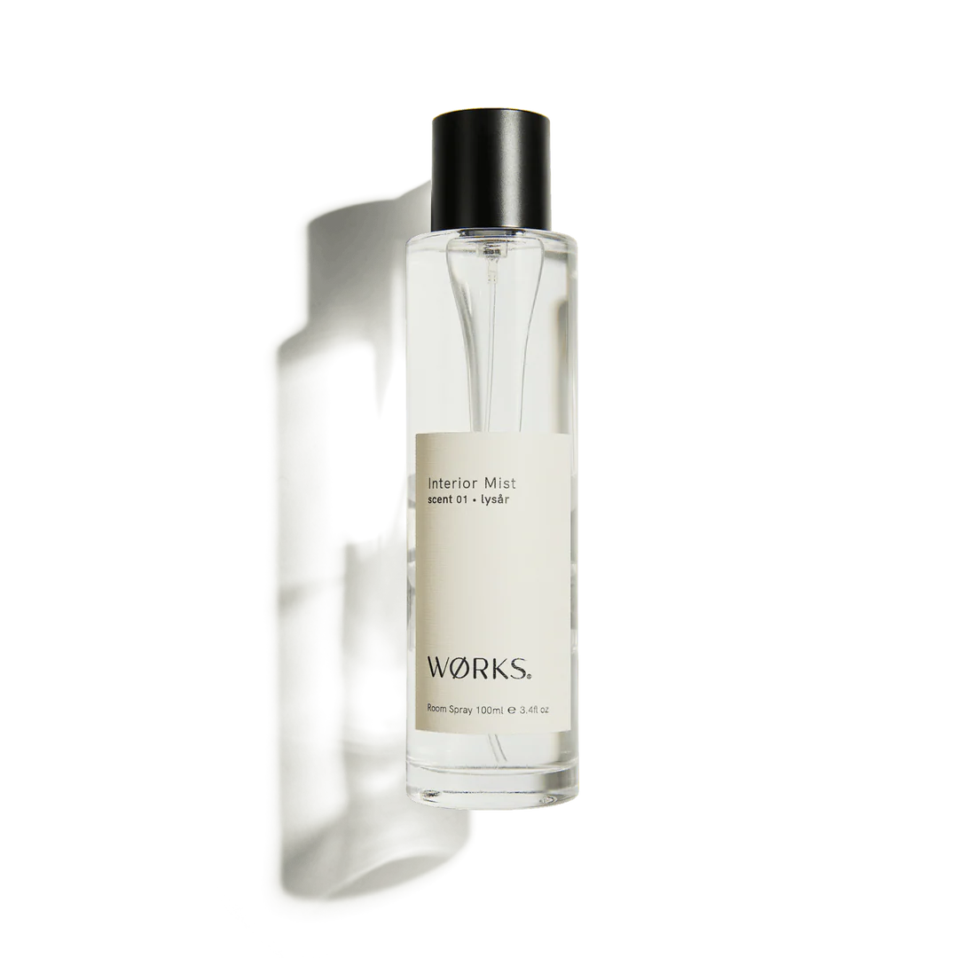 Clear bottle with black cap labeled &