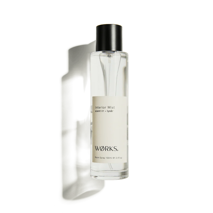 Clear bottle with black cap labeled &