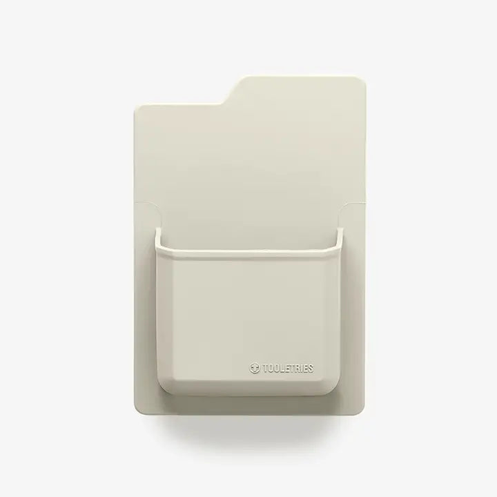 Beige wall-mounted pocket organizer with &