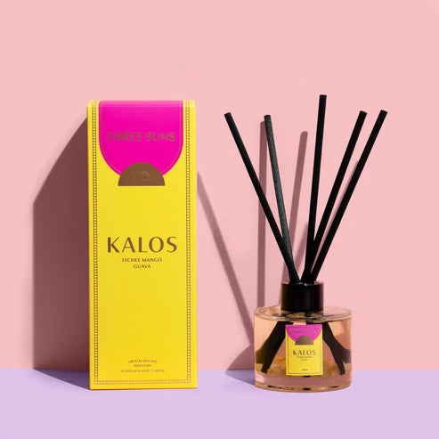 Three Suns Kalos reed diffuser and packaging on pale pink background