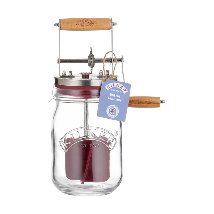 Kilner butter churner with wooden handle on a white background