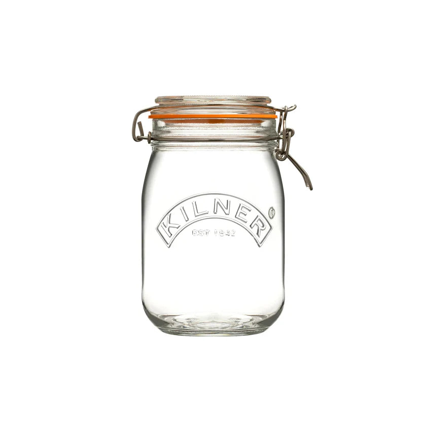 Clear glass jar with a metal clasp on a white background, featuring the Kilner logo.