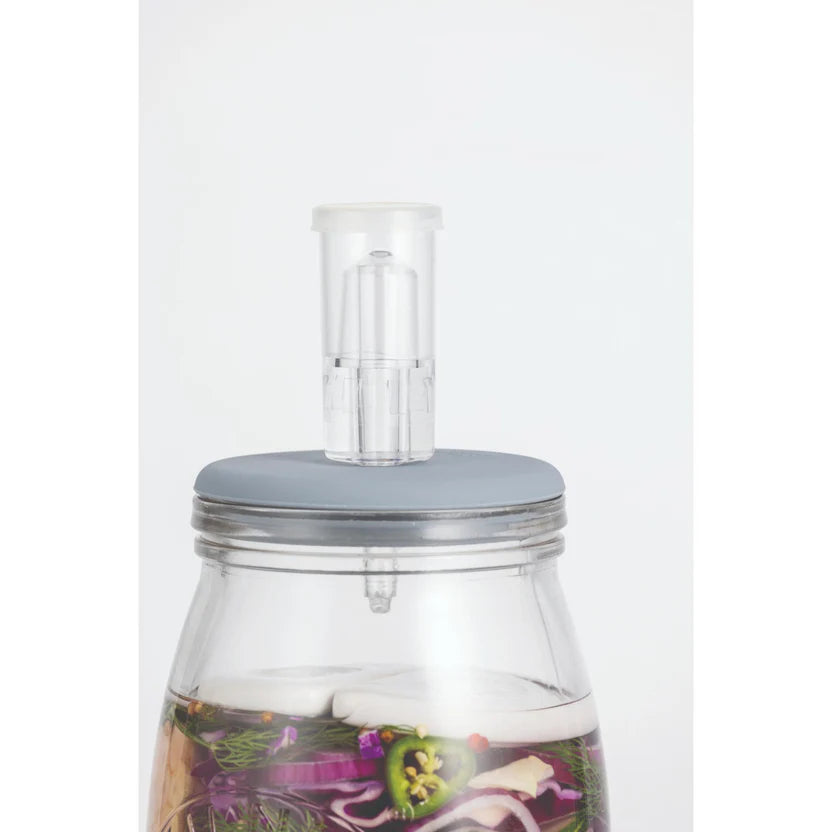 Clear fermenting jar with a grey lid and clear airlock on a white background