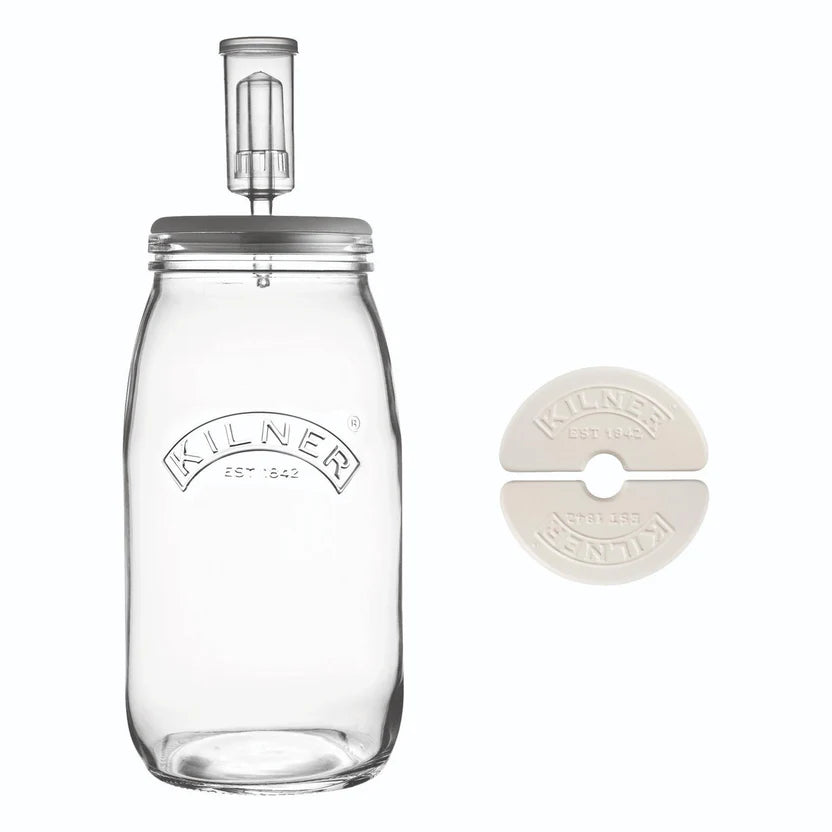Clear glass fermenting bottle with grey lid on a white background, featuring the Kilner brand.