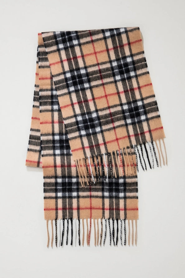 Plaid scarf with fringes on a white background