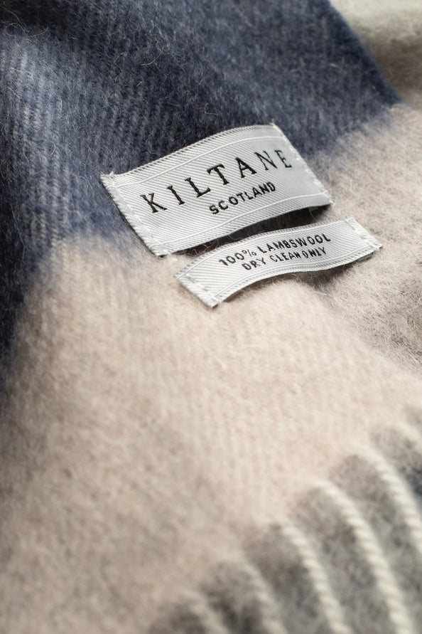 Kiltane Scotland label on a textured fabric background