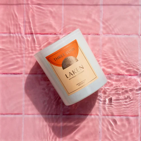 Laken candle on a pink tiled surface