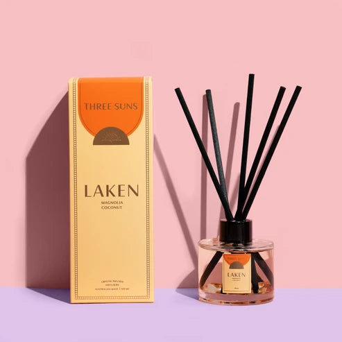 A Three Suns Laken reed diffuser and box on a pale pink background