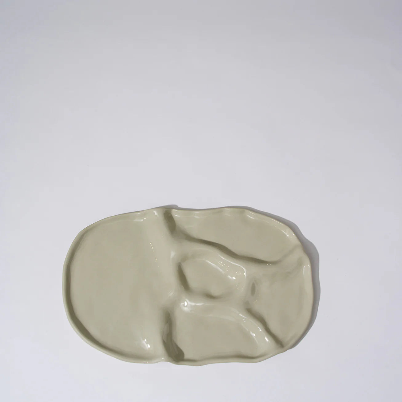 Beige ceramic dish on a white background