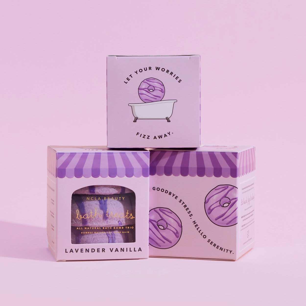 Bath product packaging with purple and white design on a pink background