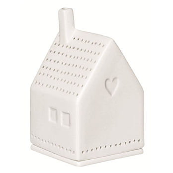 A white ceramic house-shaped container with a small chimney, perforated details, a heart emblem on the side, and a matching base, shown against a plain white background.