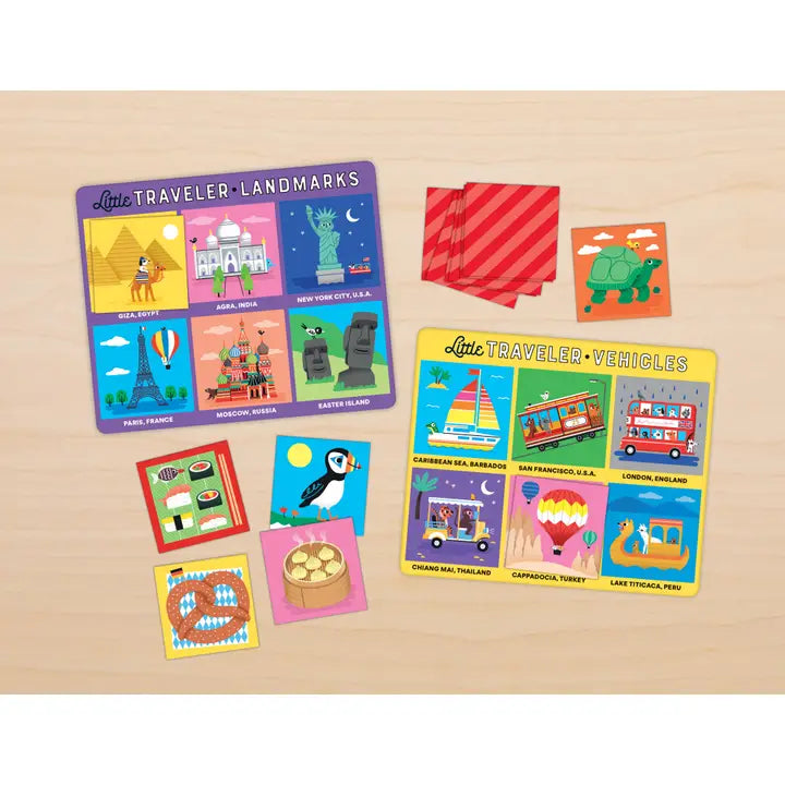 Set of bingo cards on a wooden surface, featuring landmarks and vehicles.