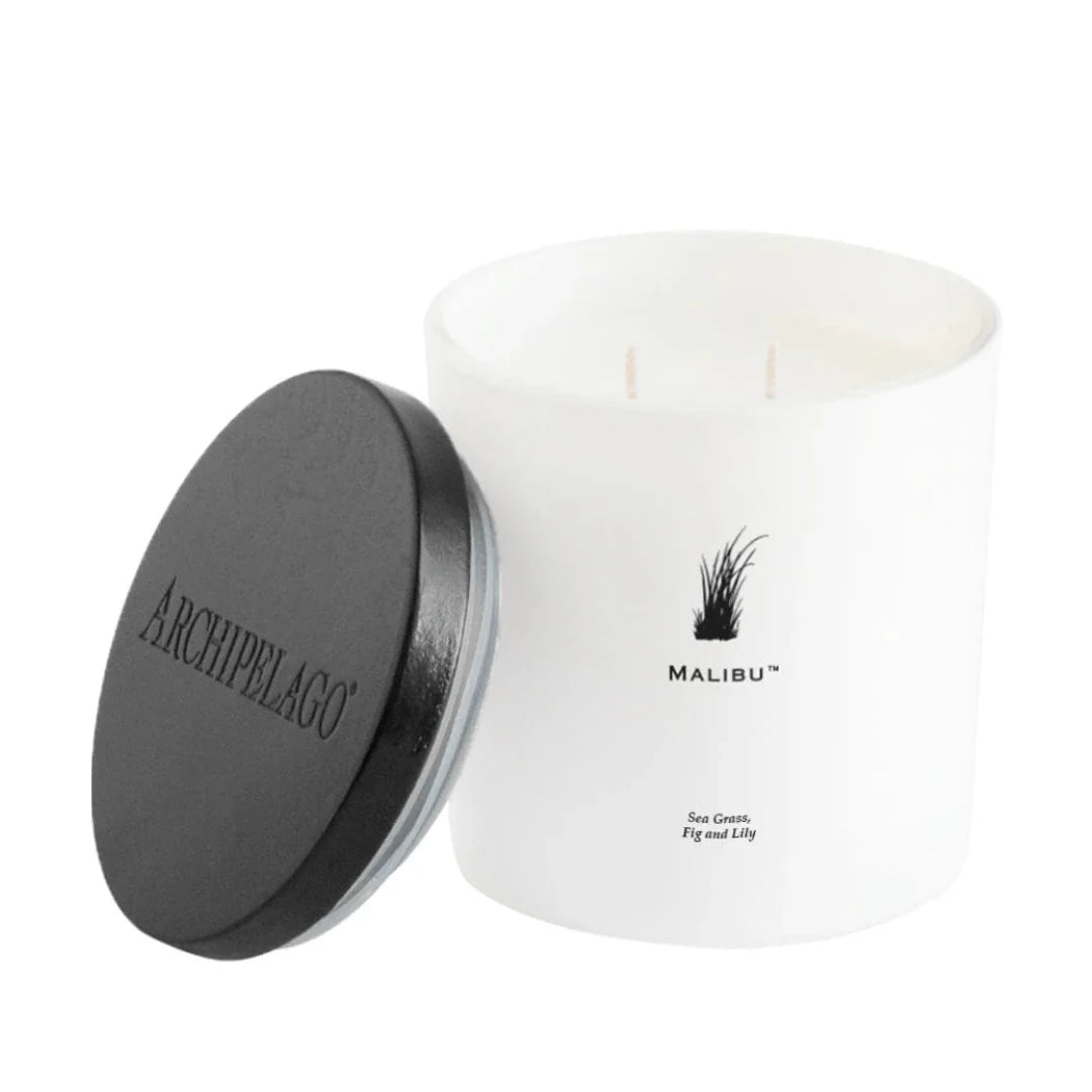 Archipelago Malibu candle in a white vessel with a black lid on a white background