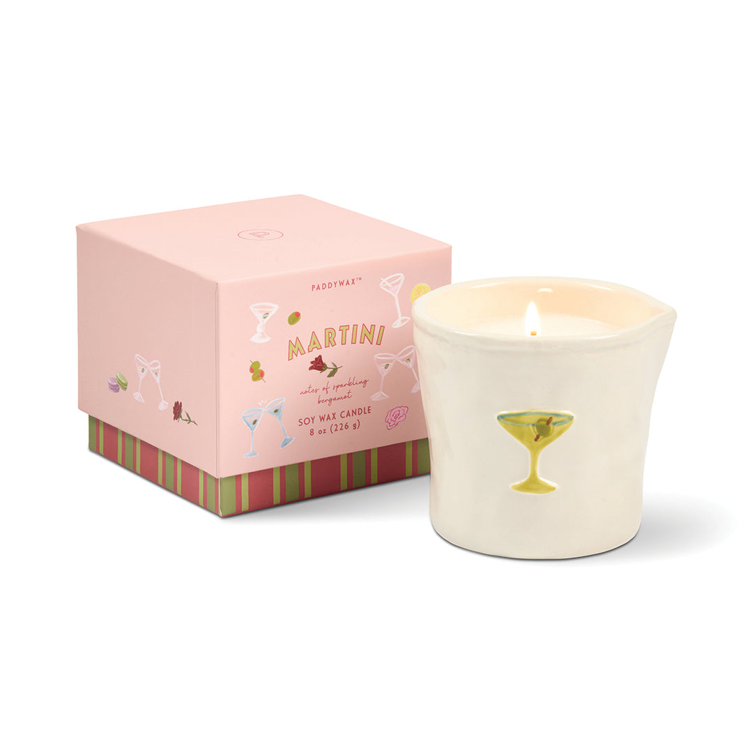Candle with a pink box labeled &
