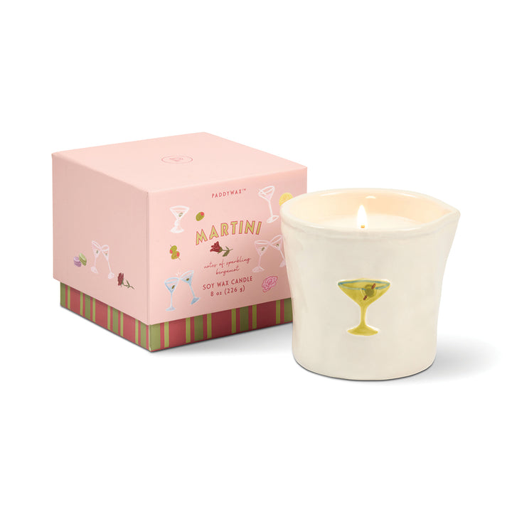 Candle with a pink box labeled &