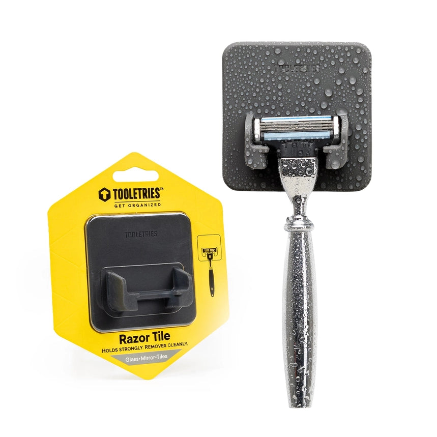 Grey silicone razor holder with razor in front of a white background, also with a packaged razor holder in yellow packaging