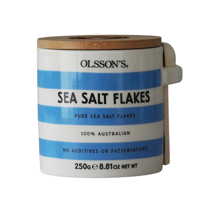 A stoneware jar with blue and white stripes of Olssons sea salt flakes