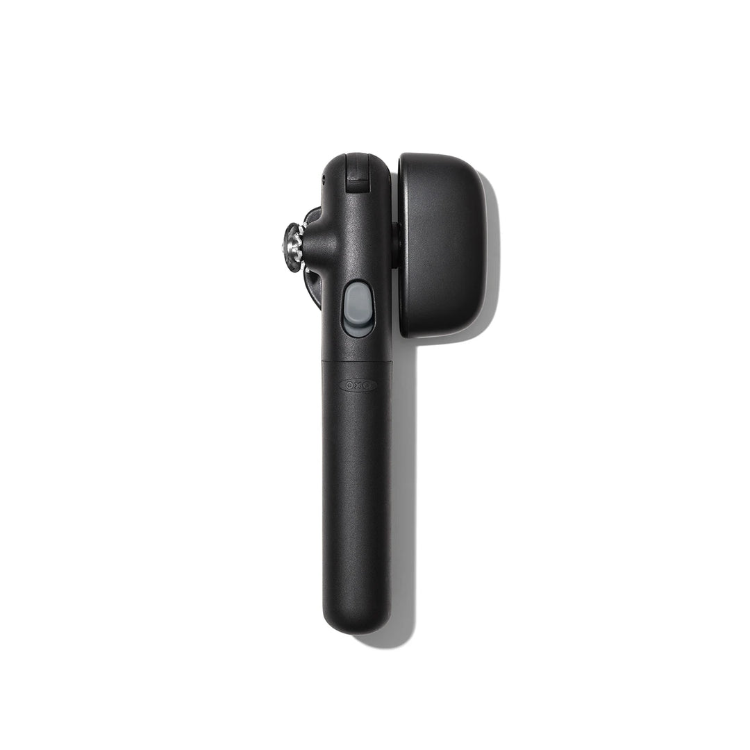 Black can opener on a white background