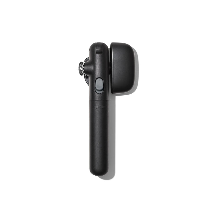 Black can opener on a white background