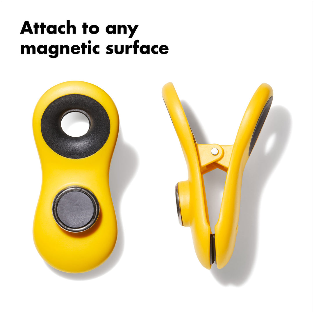 Yellow magnetic clamps on a white background with text &