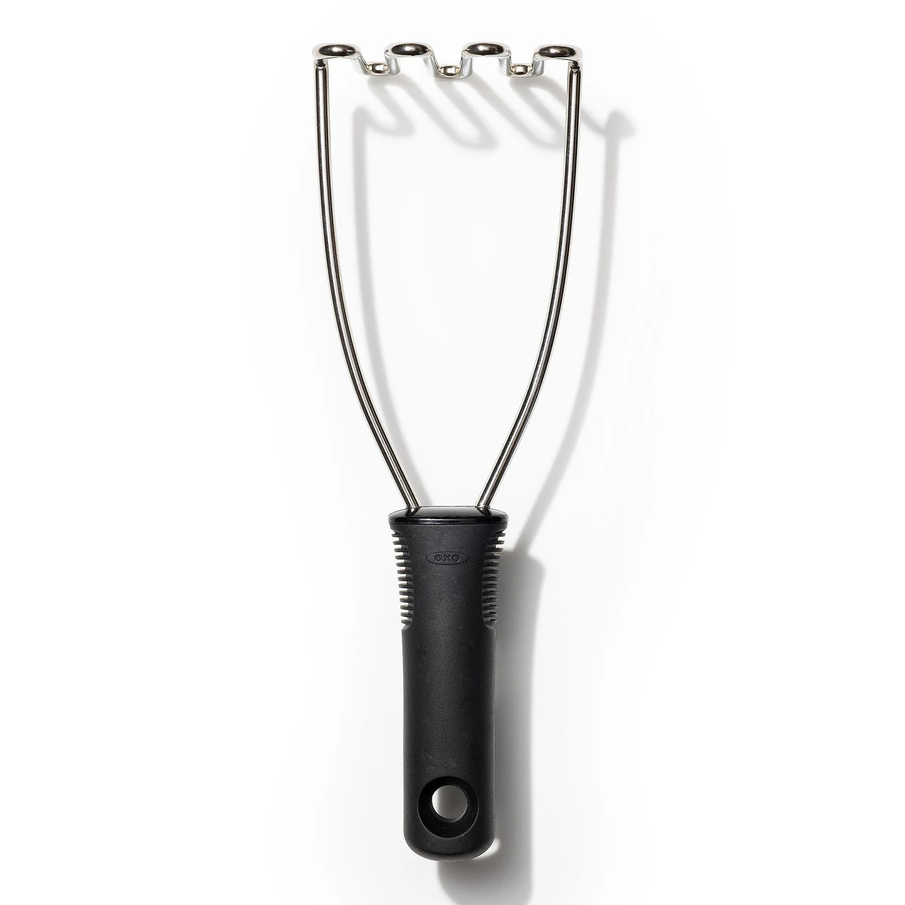 Black handled potato masher on a white background
