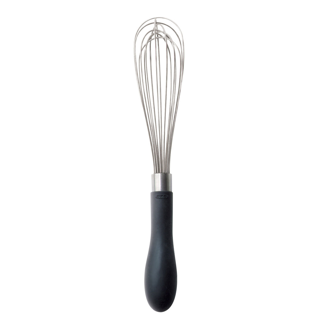 Metal whisk with black handle on a white background