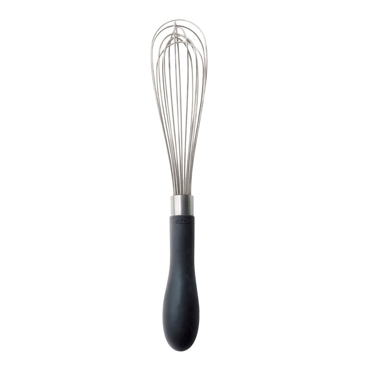 Metal whisk with black handle on a white background