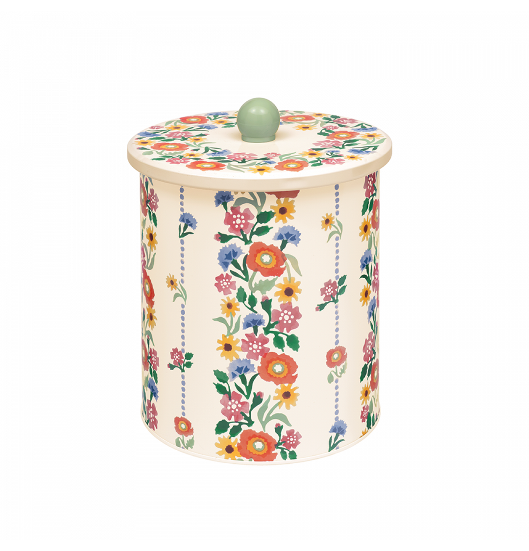 A cylindrical lidded storage jar or canister with a cream background and a colorful floral print, featuring a small light green spherical knob on top, shown on a plain white background.