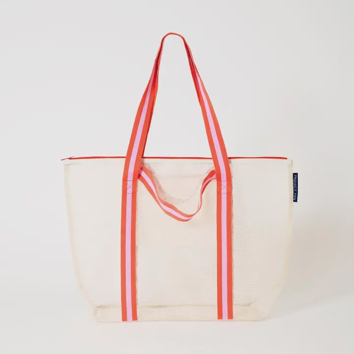 Off white mesh tote bag with red handles on a light gray background