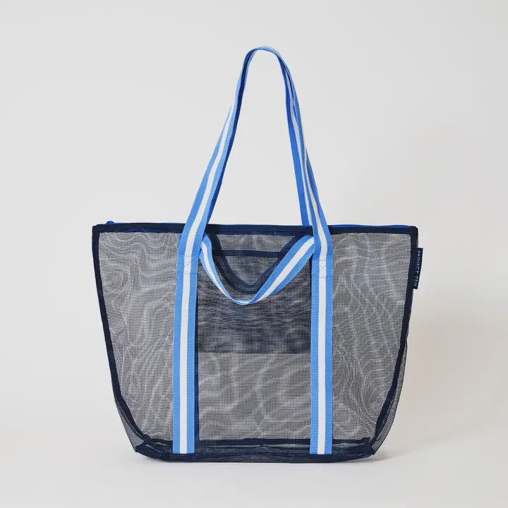 Mesh tote bag with blue handles and trim on a light gray background