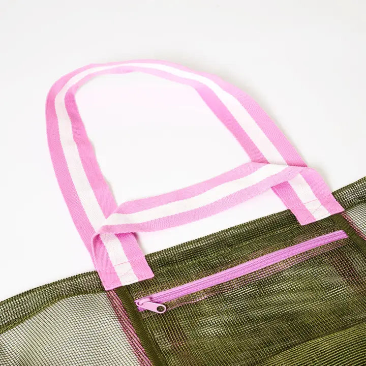 Green mesh bag with pink trim and zipper on a white background