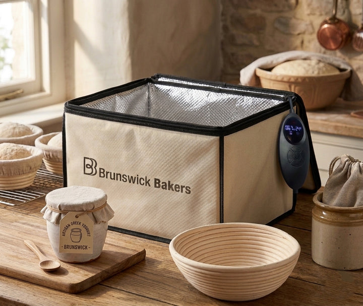 Brunswick Bakers insulated bread box on a kitchen counter with bread and jars.