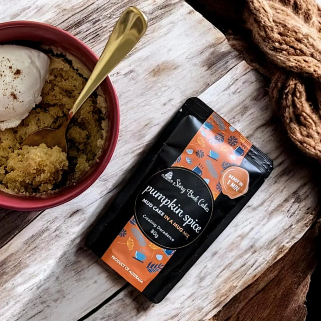 Pumpkin spice cake in a mug packet mix on a wooden background