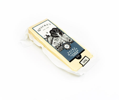 A wedge of Quickes extra mature cheddar in packaging on a white background