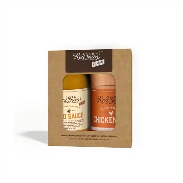 A kraft gift box with red Gum BBQ"s gold sauce & chicken seasoning
